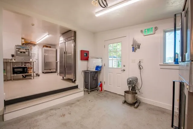 a view of kitchen with furniture and wooden floor