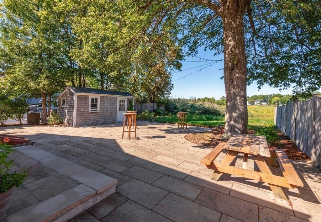 162 Main Street Essex, MA 01929 - Photo 4 of 26 a view of a backyard with a garden