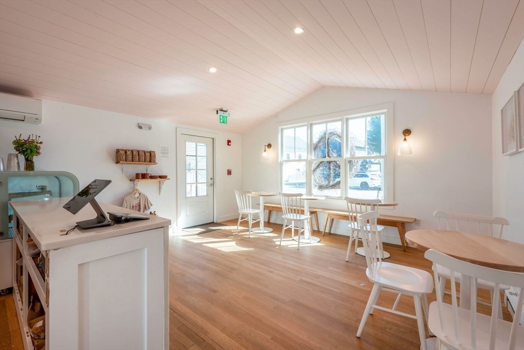 162 Main Street Essex, MA 01929 - Photo 9 of 26 a living room with furniture and a large window