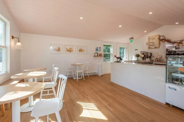 a view of a dining room with furniture window and outside view