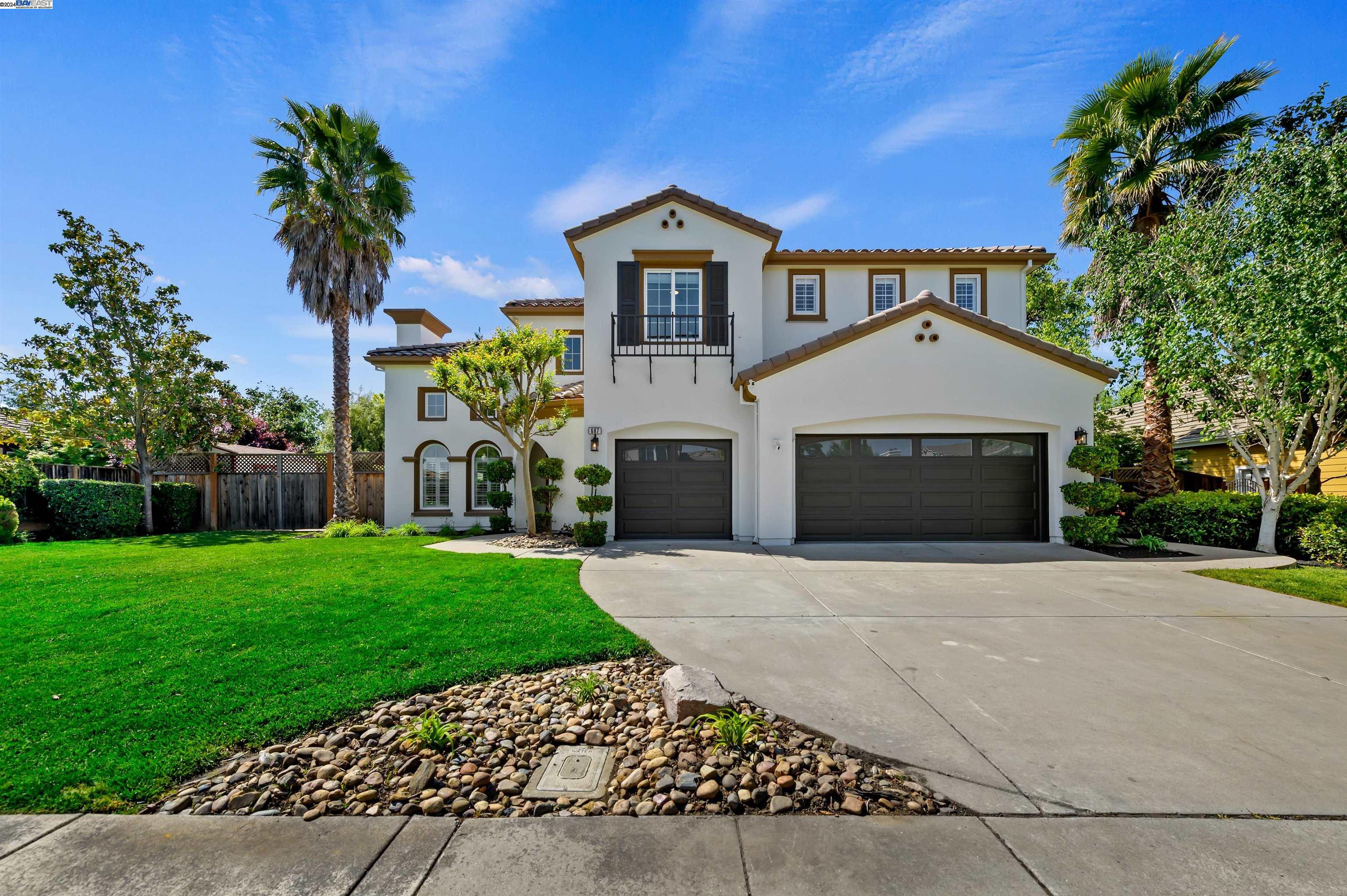 687 Trinity Hills Lane Livermore, CA 94550 - Photo 1 of 1 a front view of a house with a yard and garage