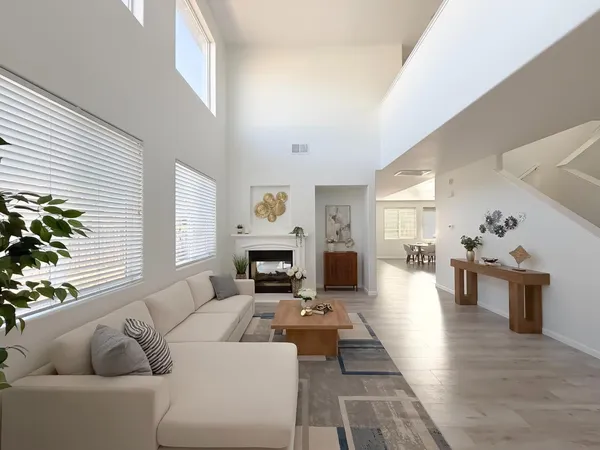 a living room with furniture and a fireplace