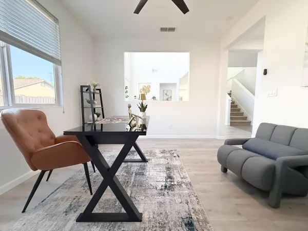 a living room with furniture and a window