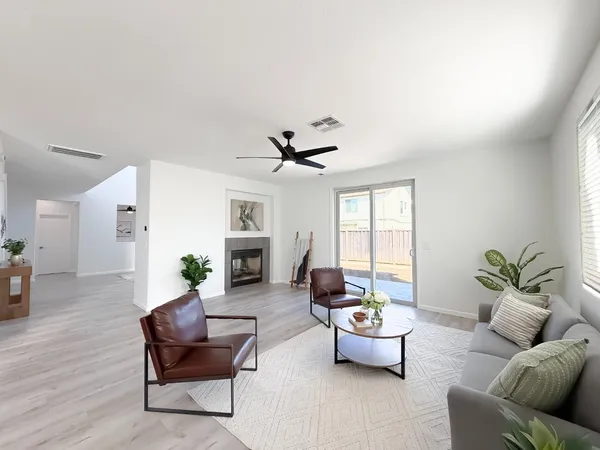 a kitchen with a sink a stove and cabinets