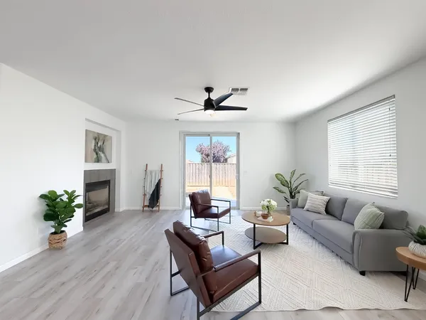 a kitchen with granite countertop white cabinets and stainless steel appliances