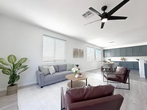 a view of a dining room with furniture and a window