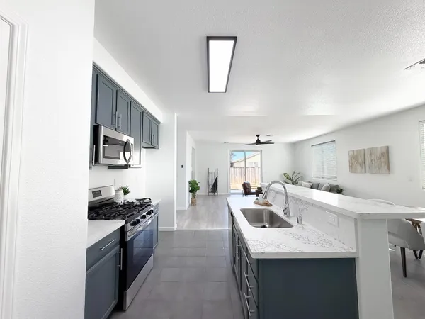 a view of a ceiling fan and window