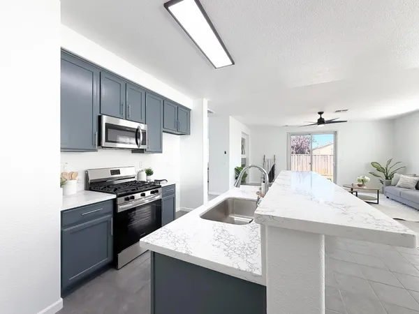 a view of a storage & utility room with a sink