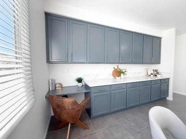 a view of a livingroom with a ceiling fan and window
