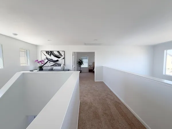 an empty room with a ceiling fan and a window