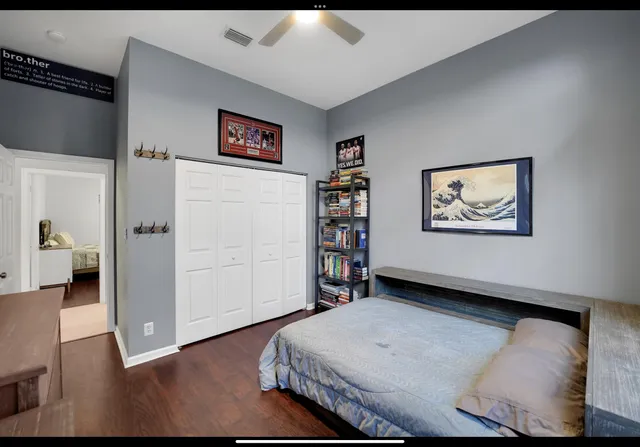 a living room with furniture and a walk in closet