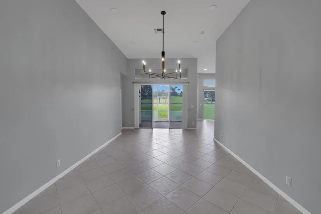 a view of a room with window and wooden floor