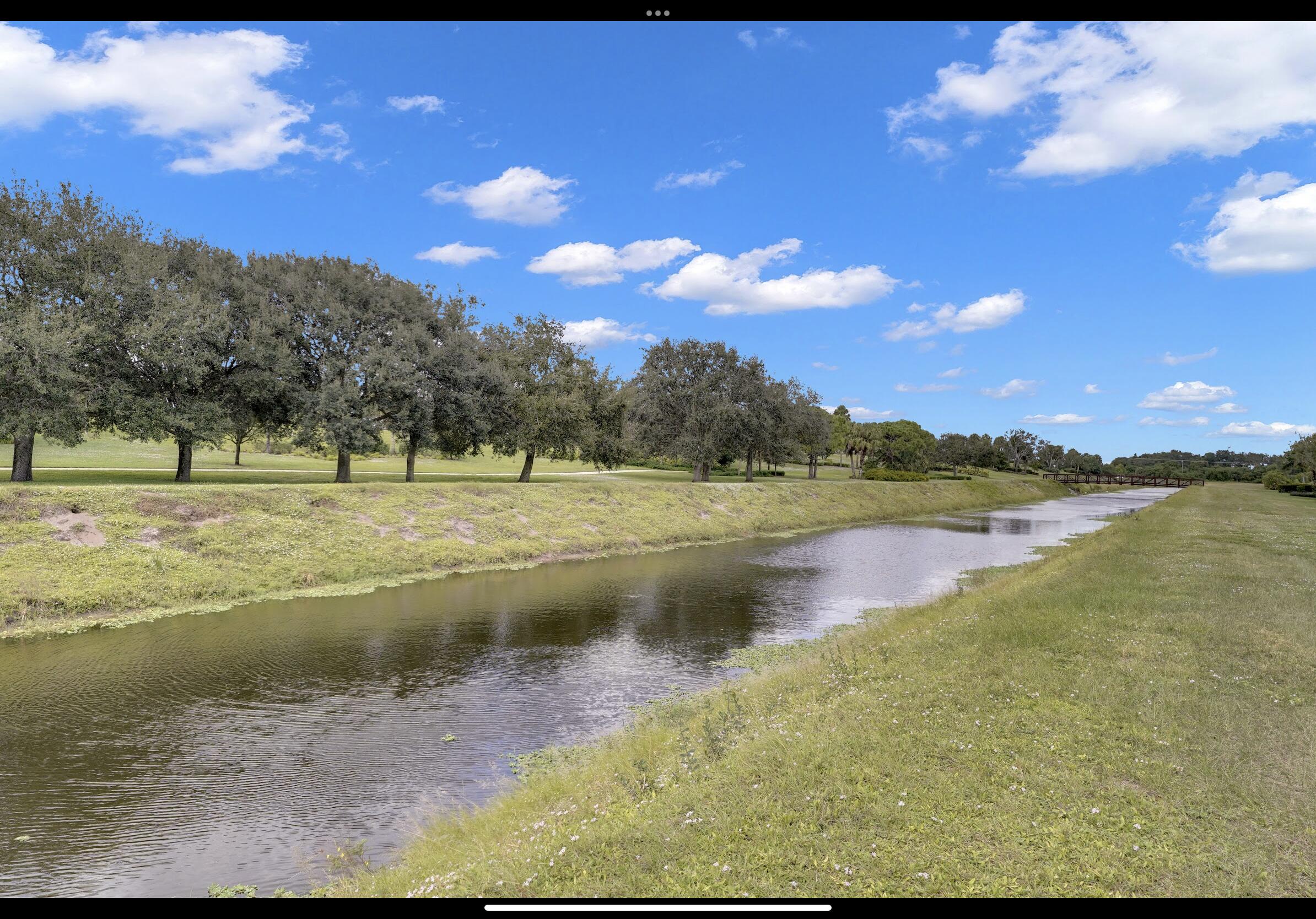 7922 Monarch Court Delray Beach, FL 33446 - Photo 20 of 31 a view of a lake with a yard