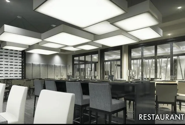 a kitchen with a dining table chairs and granite counter tops