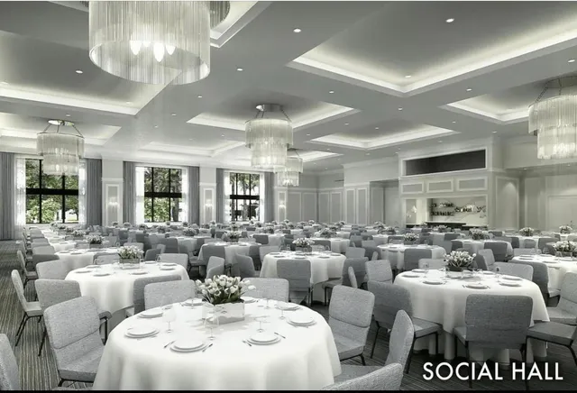 a very nice looking living room with white walls and dining table