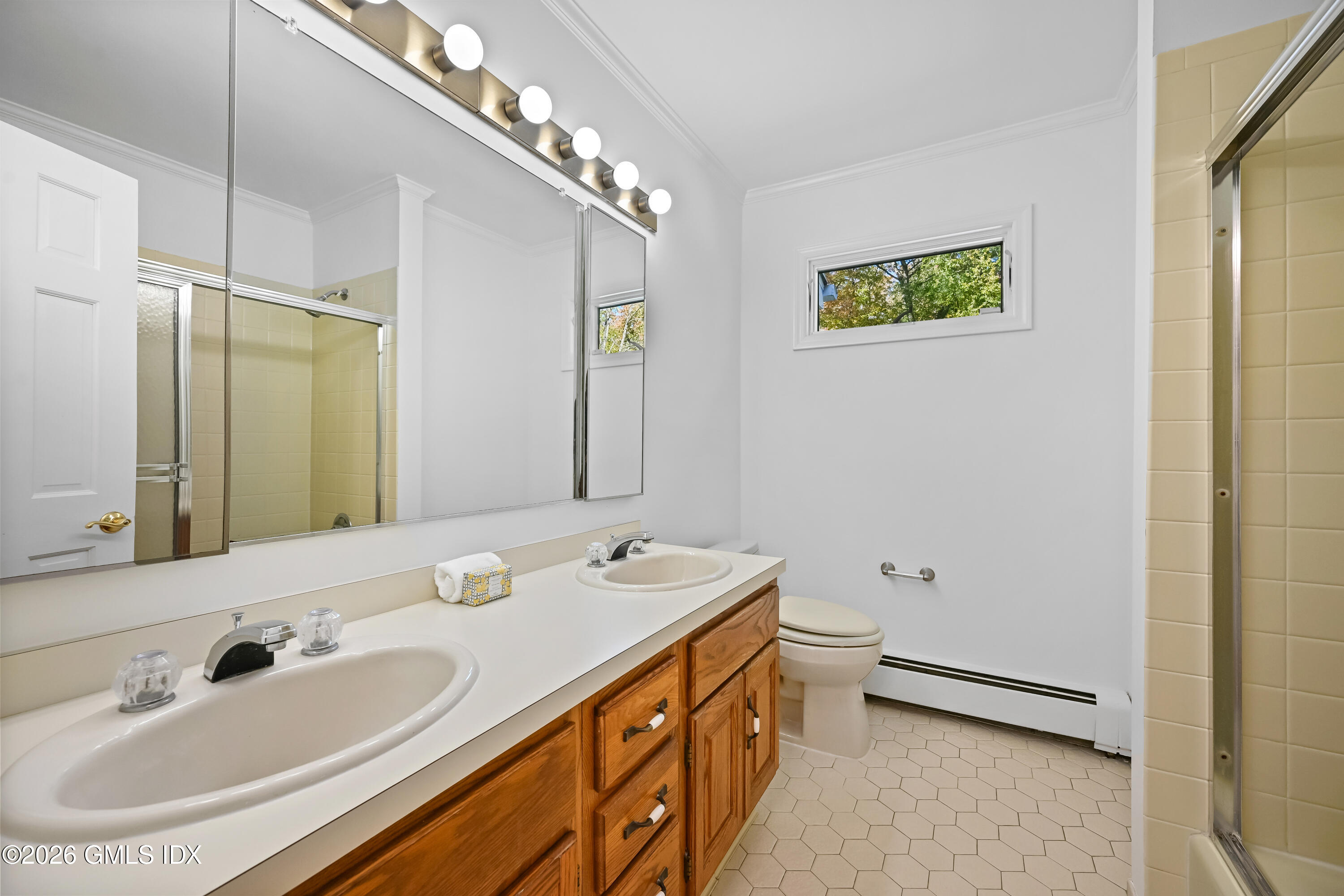 38 Bedford Road Greenwich, CT 06831 - Photo 18 of 32 a bathroom with a double vanity sink mirror and toilet