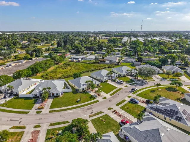 an aerial view of residential houses with outdoor space