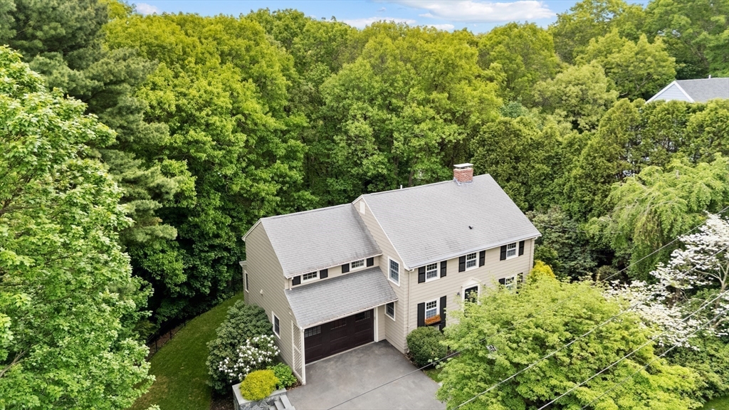105 Thornberry Road Winchester, MA 01890 - Photo 34 of 35 an aerial view of a house with swimming pool and garden