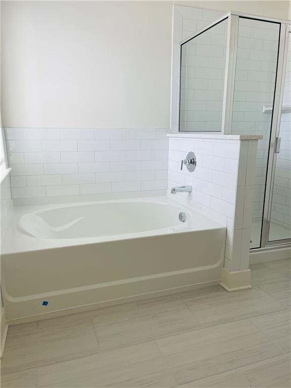 72 Garrison Drive Winder, GA 30680 - Photo 15 of 20 a bathroom with a bathtub