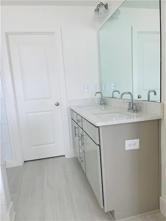 a bathroom with a glass door shower