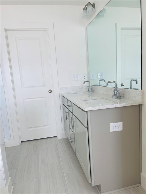 72 Garrison Drive Winder, GA 30680 - Photo 16 of 20 a utility room with a sink and a mirror