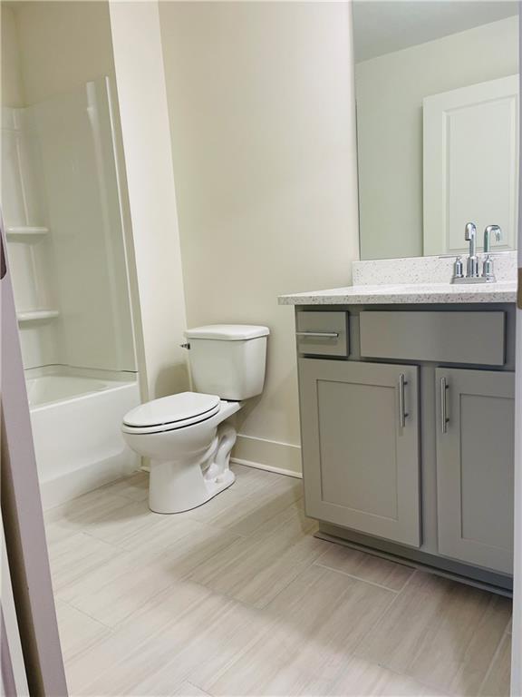 72 Garrison Drive Winder, GA 30680 - Photo 9 of 20 a bathroom with a sink toilet and shower