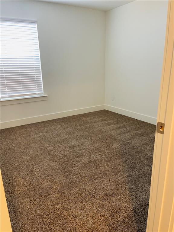 72 Garrison Drive Winder, GA 30680 - Photo 10 of 20 an empty room with a window