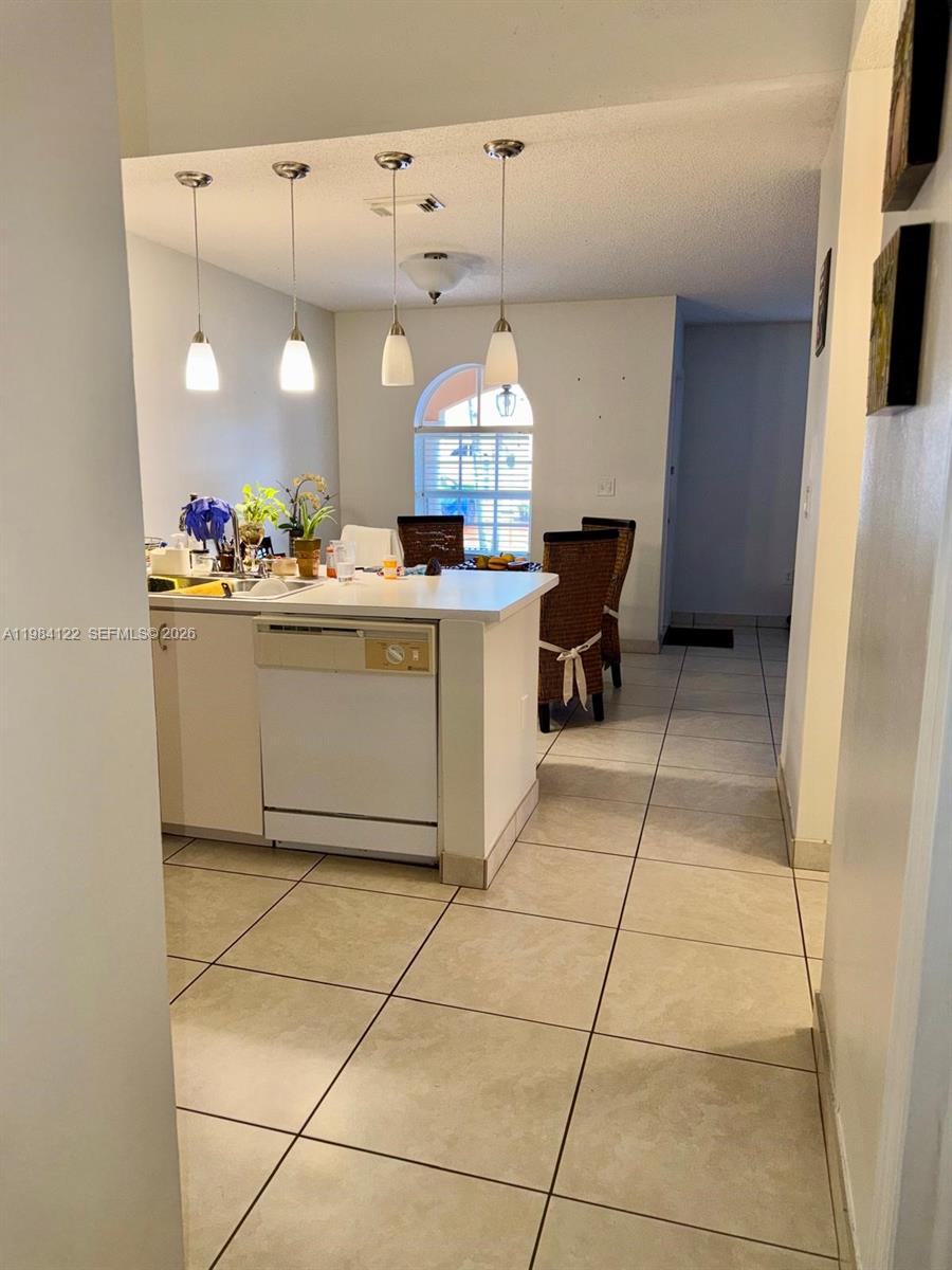 3858 Southwest 153rd Place Miami, FL 33185 - Photo 14 of 37 a kitchen with a cabinets and a stove top oven