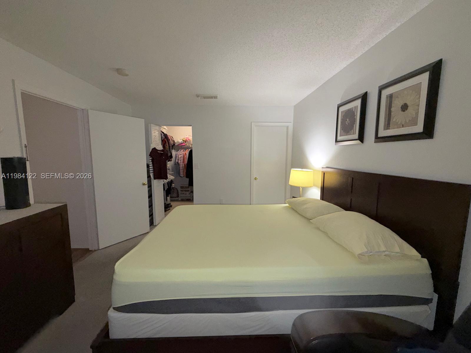 3858 Southwest 153rd Place Miami, FL 33185 - Photo 18 of 37 a bedroom with a bed and a dresser