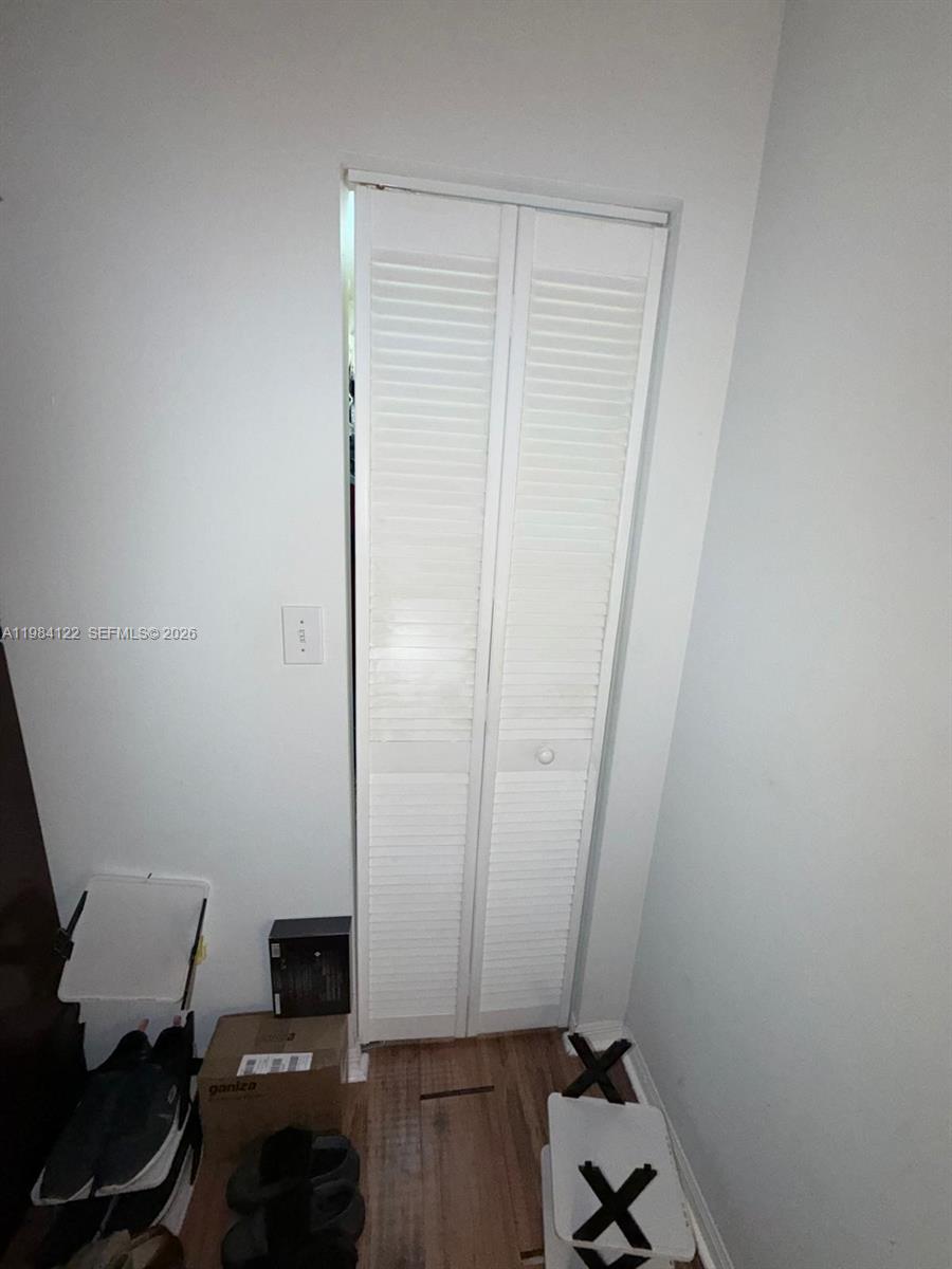 3858 Southwest 153rd Place Miami, FL 33185 - Photo 24 of 37 wooden floor and chair in a room