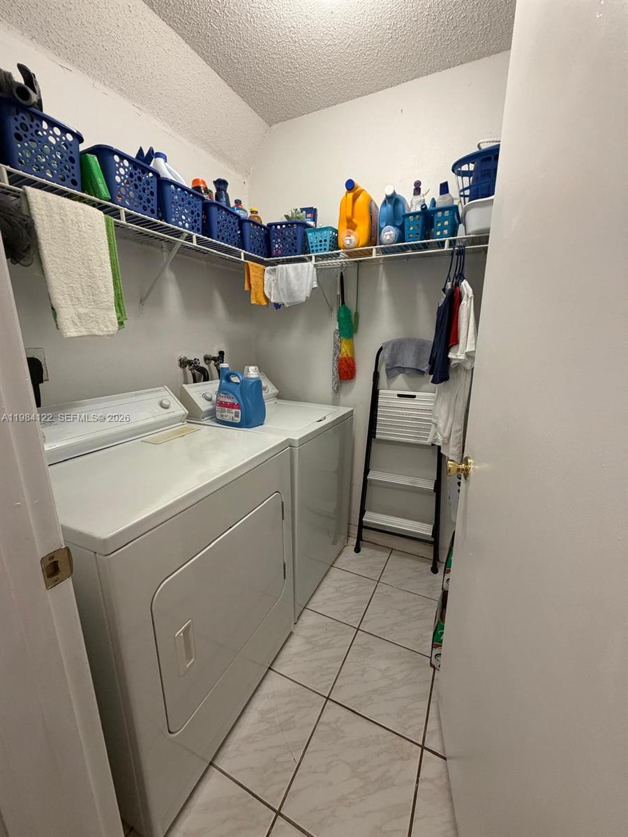 3858 Southwest 153rd Place Miami, FL 33185 - Photo 28 of 37 a utility room with dryer and washer