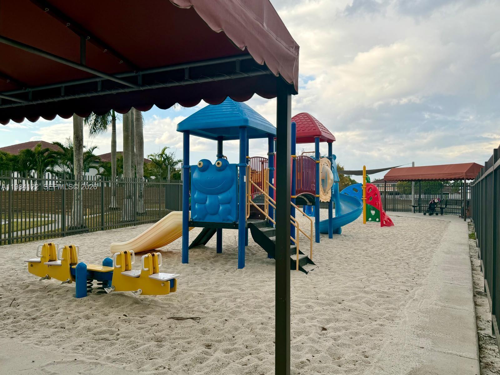 3858 Southwest 153rd Place Miami, FL 33185 - Photo 33 of 37 a view of playground with a slide and swing