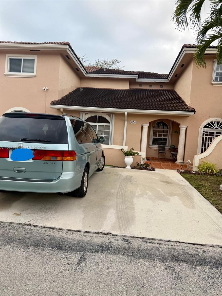 3858 Southwest 153rd Place Miami, FL 33185 - Photo 8 of 37 a view of a car parked in front of a house
