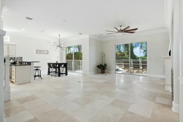 a view of a dining room with furniture window and outside view
