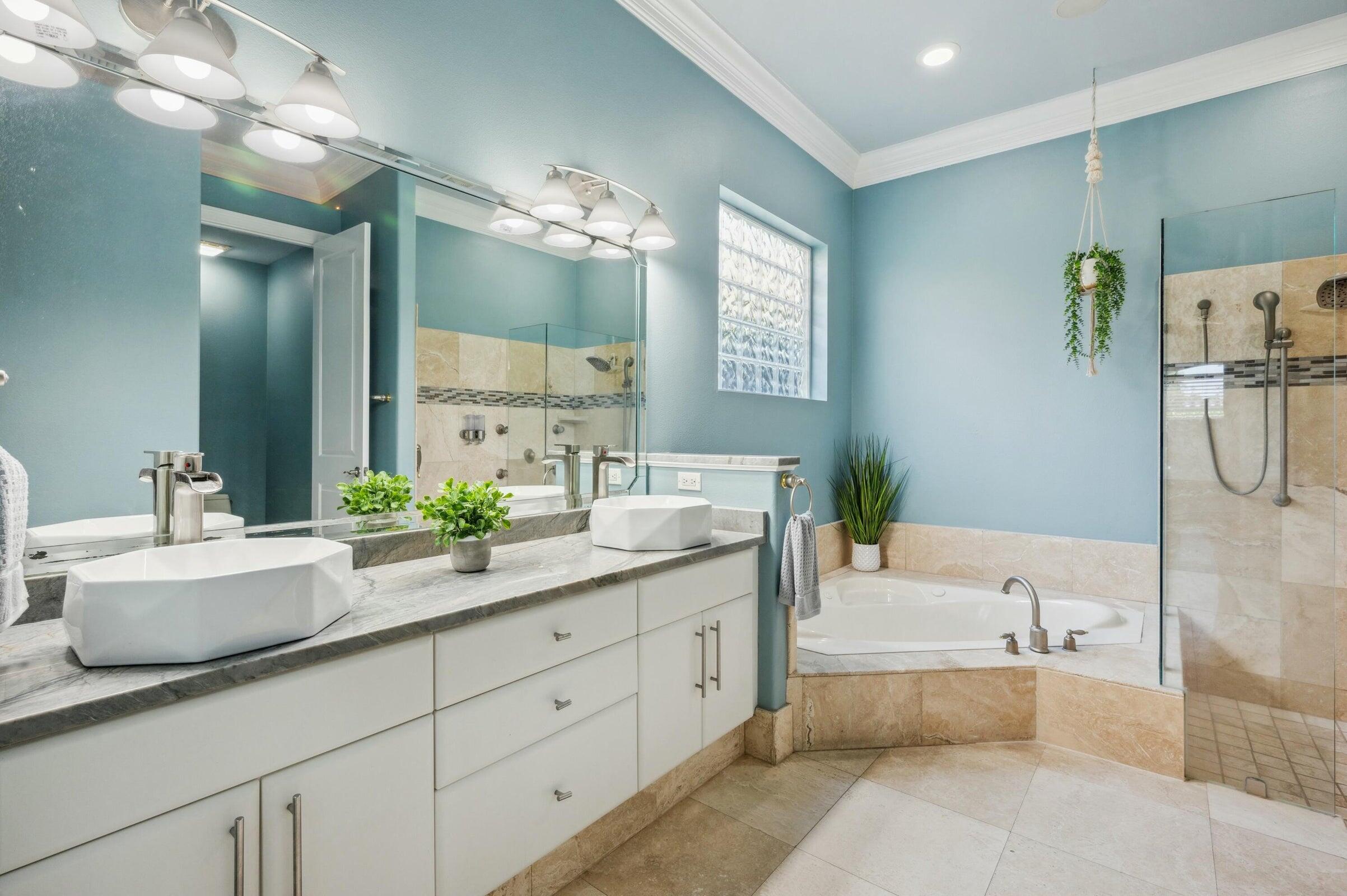 294 Ketch Court Destin, FL 32541 - Photo 24 of 56 a spacious bathroom with a granite countertop sink mirror and bathtub