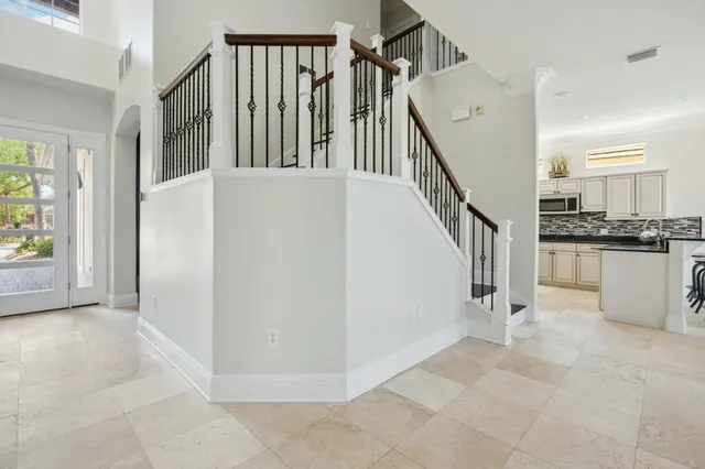 a bathroom with a glass shower door