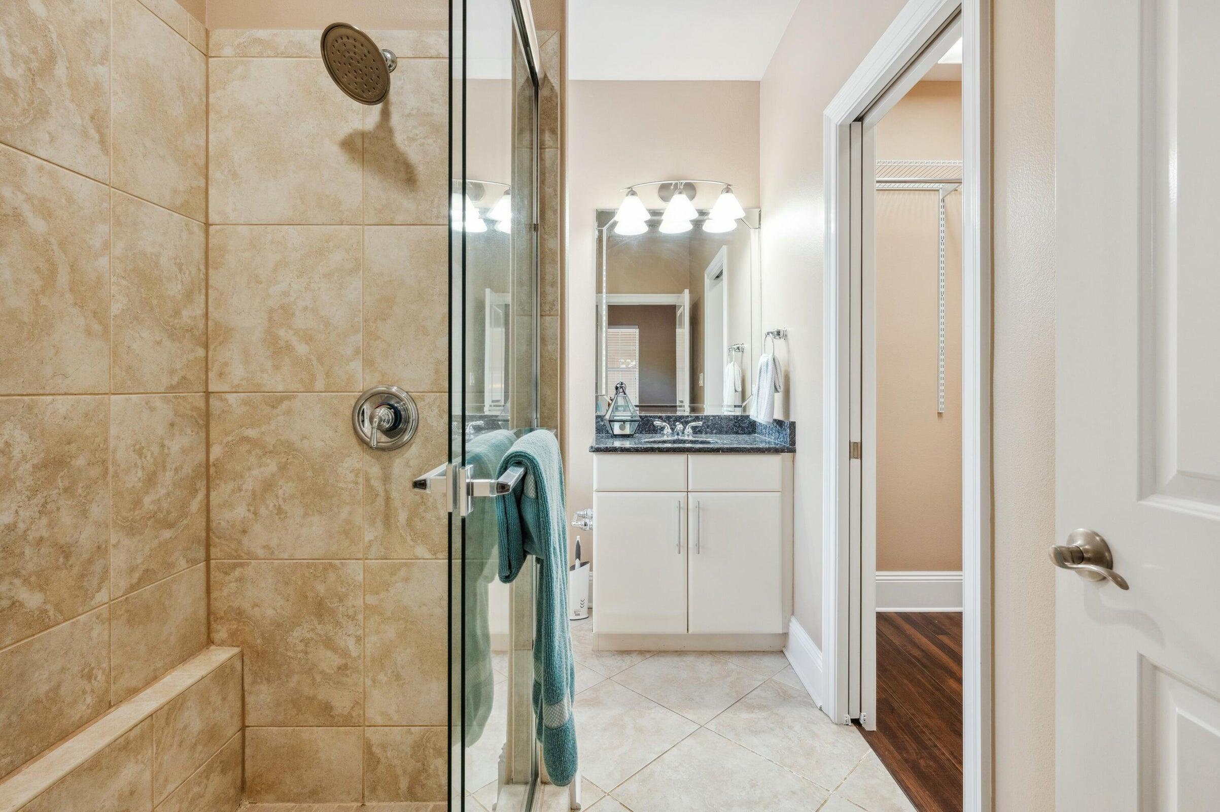 294 Ketch Court Destin, FL 32541 - Photo 32 of 56 a bathroom with a glass shower door