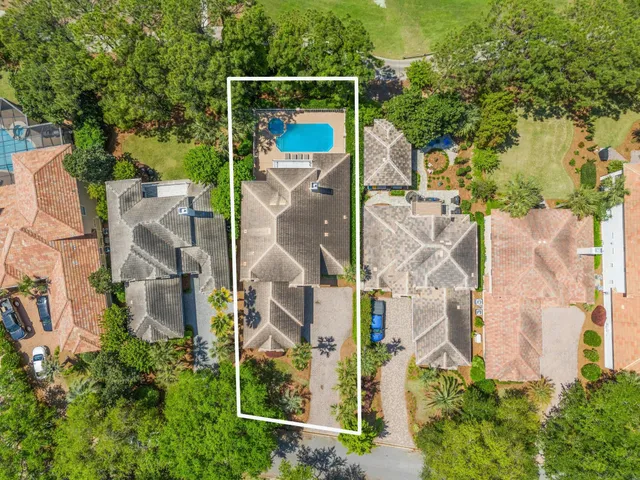 an aerial view of houses with outdoor space