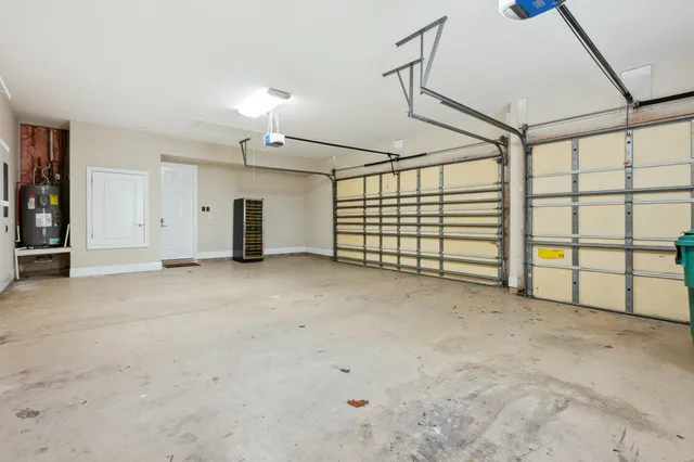 a patio with a table and chairs under an umbrella