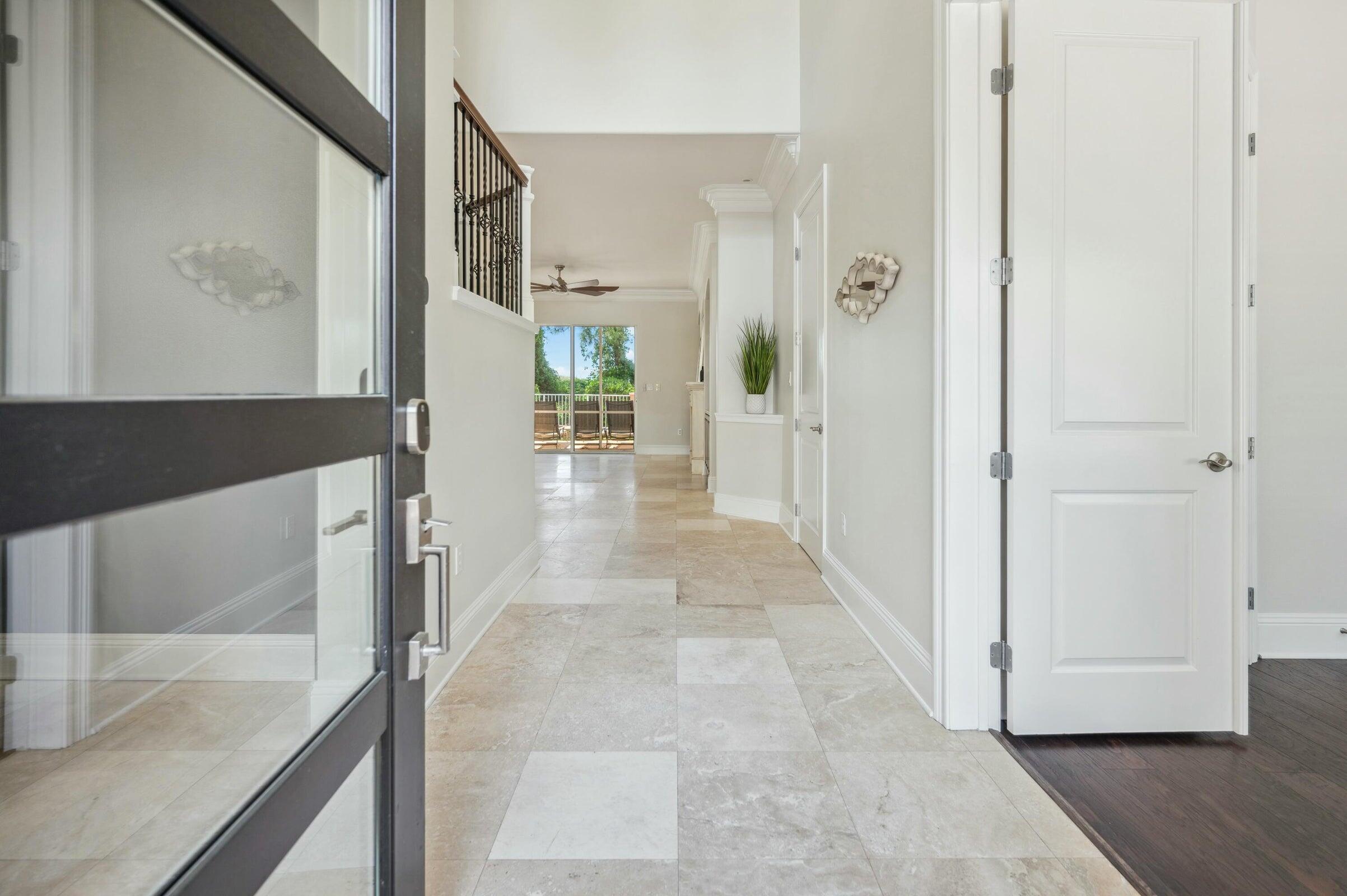 294 Ketch Court Destin, FL 32541 - Photo 5 of 56 a view of a hallway with wooden floor and staircase
