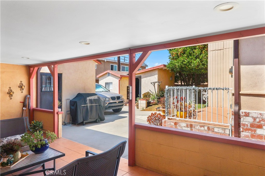 9206 Rendalia Street Bellflower, CA 90706 - Photo 21 of 27 a living room with furniture and a large window