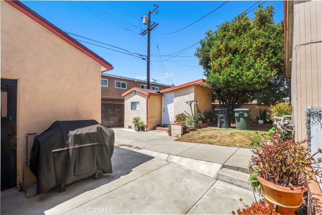 9206 Rendalia Street Bellflower, CA 90706 - Photo 22 of 27 a front view of a house with a yard