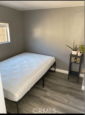 9206 Rendalia Street Bellflower, CA 90706 - Photo 23 of 27 a room with a bed and a table