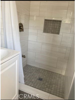 9206 Rendalia Street Bellflower, CA 90706 - Photo 26 of 27 a bathroom with a shower