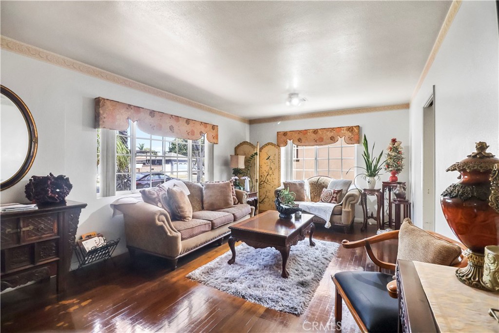 9206 Rendalia Street Bellflower, CA 90706 - Photo 4 of 27 a living room with furniture and a large window