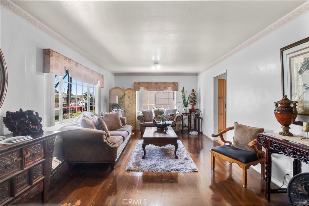 9206 Rendalia Street Bellflower, CA 90706 - Photo 5 of 27 a living room with furniture fireplace and a large window