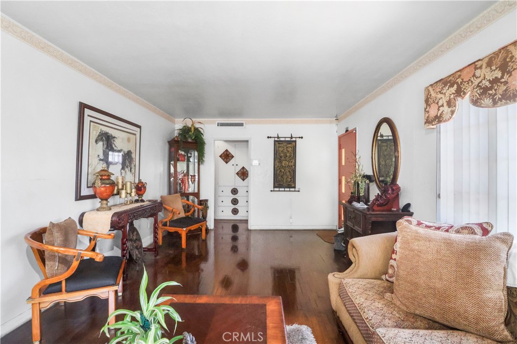 9206 Rendalia Street Bellflower, CA 90706 - Photo 6 of 27 a living room with furniture and wooden floor