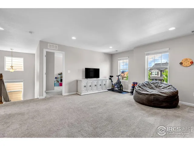 a living room with a couch and a window