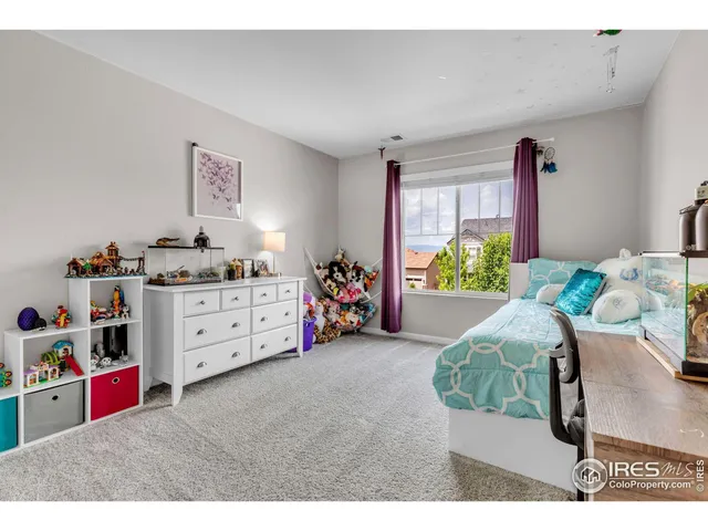 a bedroom with furniture and a bed