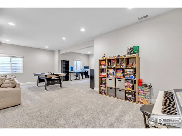 a view of a livingroom with furniture and cabinet